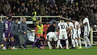 Fiorentina midfielder Edoardo Bove is surrounded by teammates as well as Inter Milan players and medical professionals after collapsing on the field during Sunday's Serie A meeting in Florence. AP