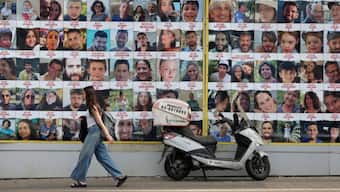 People walk past a wall displaying posters of hostages in Tel Aviv, Israel, August 18, 2024 (Photo: Reuters)