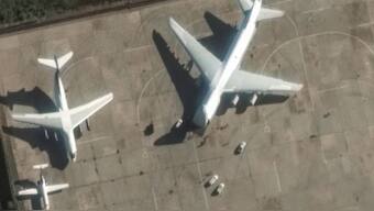 This handout satellite image released by Maxar Technologies on Friday shows an Antonov An-124 heavy transport aircraft preparing to load equipment at Khmeimim airbase in Syria. (Photo: AFP)