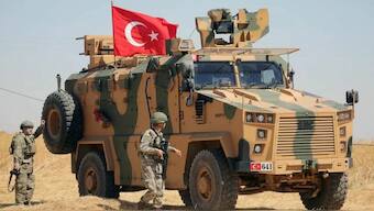 A Turkish soldier walks next to a Turkish military vehicle during a joint US-Turkey patrol near Tel Abyad, Syria September 8, 2019. (Reuters)