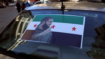 The portrait of Hayat Tahrir al-Sham (HTS) leader Abu Mohammed al-Jolani is pictured on the back of a car in the coastal Syrian city of Latakia, on December 10, 2024. (AFP)