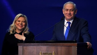 Israeli Prime Minister Benjamin Netanyahu and his wife Sara react following the announcement of exit polls in Israel's election at his Likud party headquarters in Tel Aviv. (Photo: Reuters) 