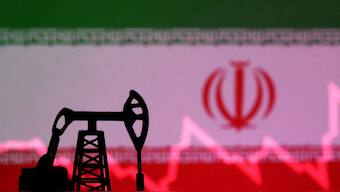 Iranian flag with stock graph and an oil pump jack miniature model are seen in this illustration. File image/ Reuters