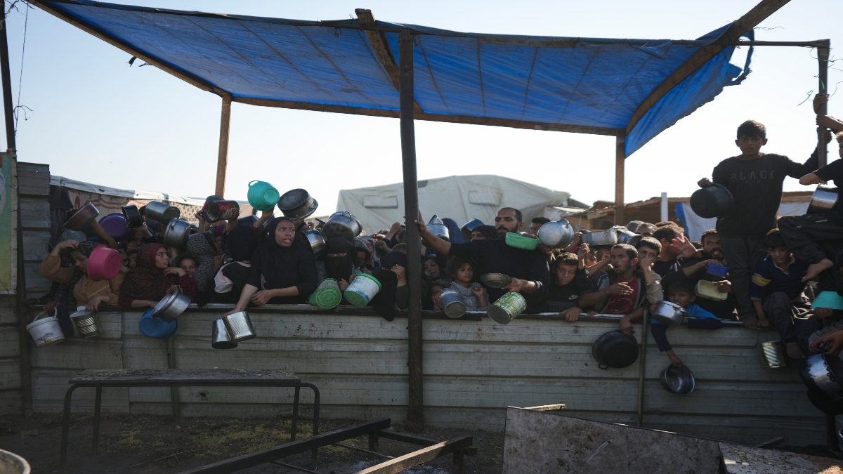 Palestinians gather for a food distribution in Khan Younis, Gaza Strip Friday. AP Palestinians gather for a food distribution in Khan Younis, Gaza Strip Friday. AP