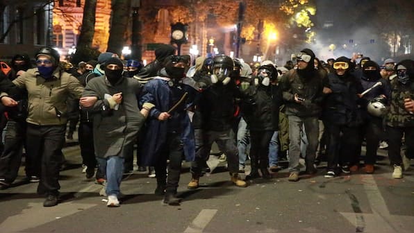 Georgia police raid opposition offices as PM vows to curb protests