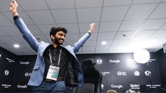 Indian Grandmaster D Gukesh celebrates after being crowned the youngest chess world champion ever at the end of Game 14 of the 2024 FIDE World Chess Championship in Singapore. Image credit: Eng Chin An/FIDE