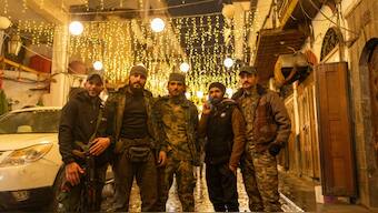 Members of the HTS rebel group that overthrew the Assad regime pose for a portrait in the ancient town of old Damascus, in Syria, December 28, 2024. File Image/AP