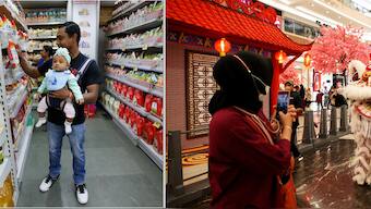 (L) A customer carries his daughter as he buys goods at a store inside a shopping mall in Kolkata, India; A woman takes photos with a lion dance ahead of the Chinese Lunar New Year of the Rabbit at Pondok Indah shopping mall in Jakarta, Indonesia 