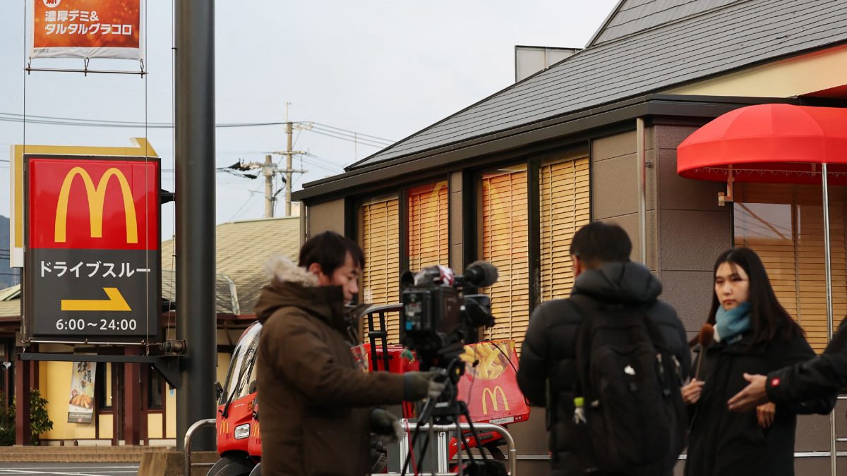 Members of media are seen in front of a McDonald's branch where a junior high school student was stabbed to death in Kitakyushu city, Fukuoka prefecture. AFP Members of media are seen in front of a McDonald's branch where a junior high school student was stabbed to death in Kitakyushu city, Fukuoka prefecture. AFP