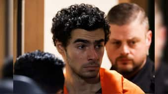 Luigi Mangione, 26, a suspect in the New York City killing of UnitedHealth executive Brian Thompson, is escorted after an extradition hearing at Blair County Court House in Hollidaysburg, Pennsylvania, US, December 10, 2024. File Image/Reuters