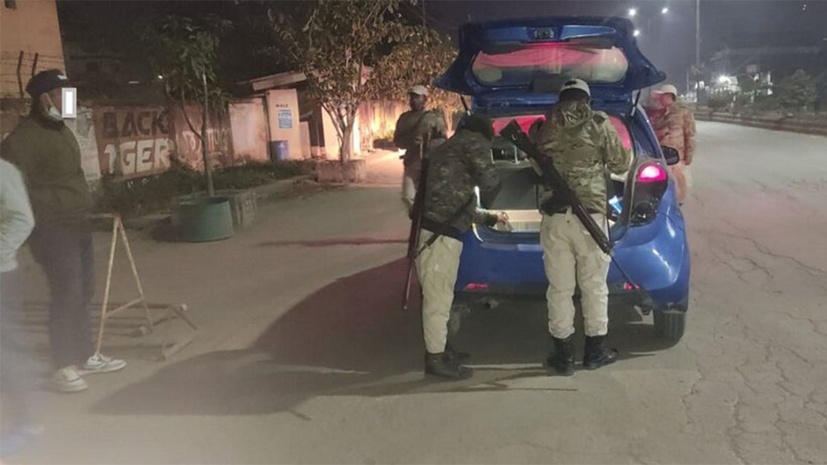 Security personnel check a vehicle in a sensitive area of Manipur. PTI Security personnel check a vehicle in a sensitive area of Manipur. PTI