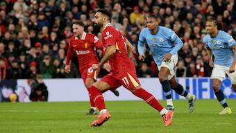 Liverpool forward Mohamed Salah successfully converts a penalty to score his team's second goal in their Premier League home game against Manchester City. AP