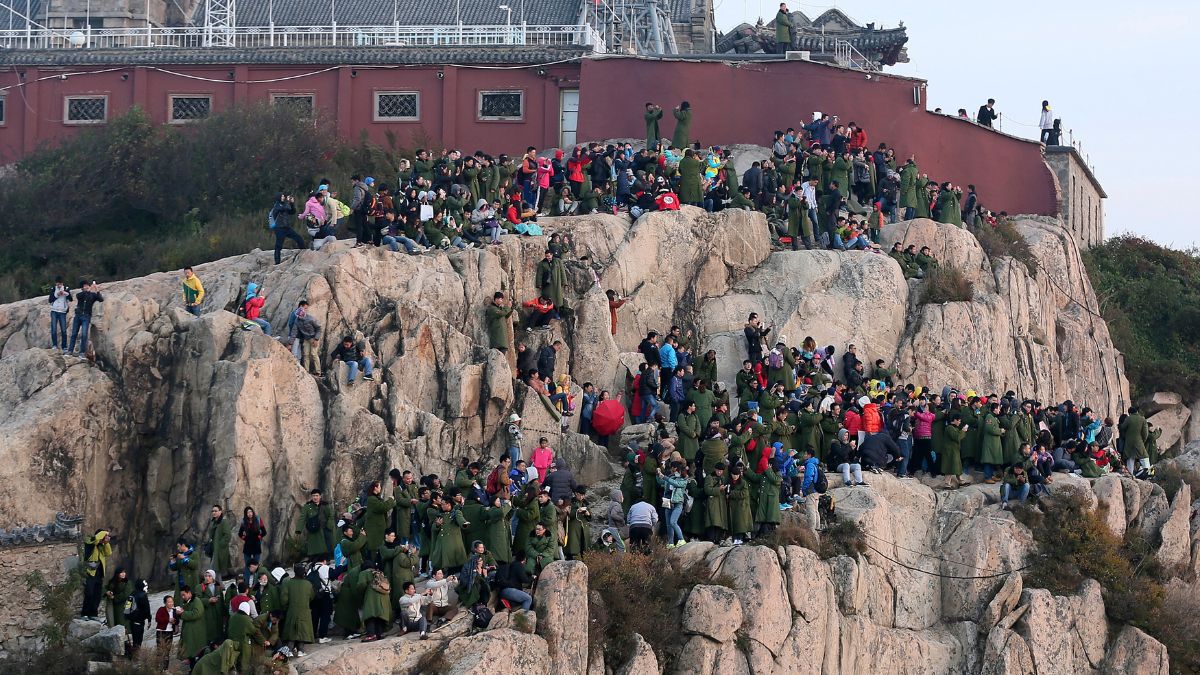 Tourists crowd on the mountain edge as they watch a sunrise on a peak of Mount Tai, on the first day of the seven-day national day holiday, in Tai'an, Shandong province, October 1, 2014. File Image/Reuters Tourists crowd on the mountain edge as they watch a sunrise on a peak of Mount Tai, on the first day of the seven-day national day holiday, in Tai'an, Shandong province, October 1, 2014. File Image/Reuters