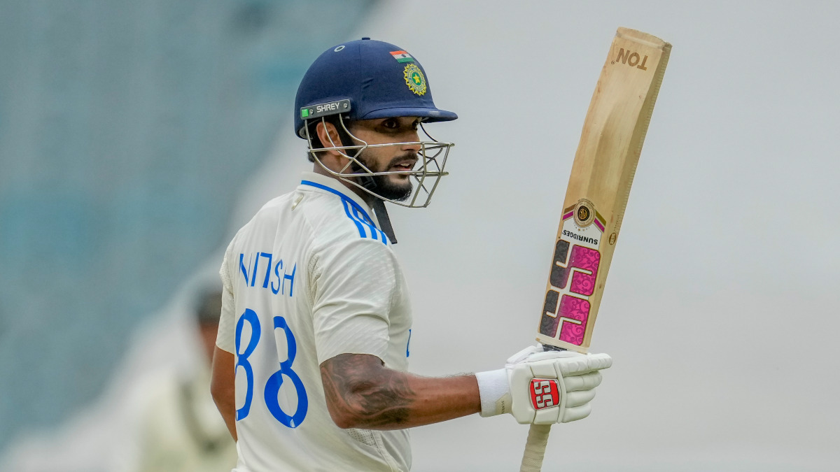 India all-rounder Nitish Kumar Reddy raises his bat after completing his maiden Test half-century on Day 3 of the fourth Test against Australia in Melbourne. AP India all-rounder Nitish Kumar Reddy raises his bat after completing his maiden Test half-century on Day 3 of the fourth Test against Australia in Melbourne. AP