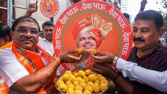 Supporters celebrate with sweets after Devendra Fadnavis was unanimously elected as BJP legislative party leader, paving the way for him to be sworn in as Maharashtra Chief Minister, in Thane, Mumbai, Wednesday, December 4, 2024. PTI 
