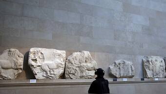 A man views examples of the Parthenon sculptures, sometimes referred to in the UK as the Elgin Marbles, on display at the British Museum in London, Britain. Reuters