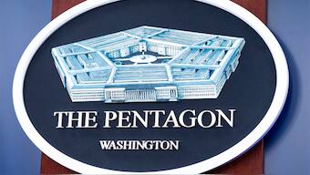 The Department of Defence logo is seen on the wall in the Press Briefing room at the Pentagon. AP