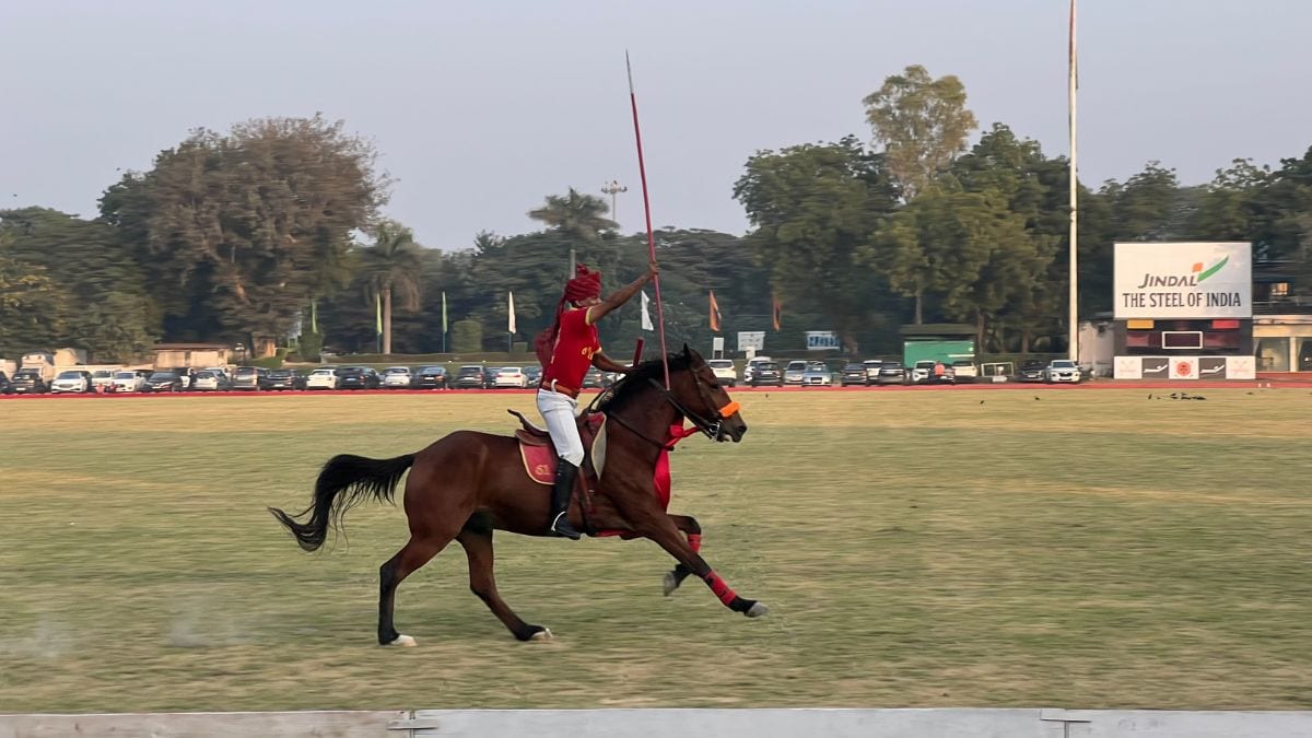 A soldier from the 61st Cavalry showcases his riding skills within the course of the Col. Girdhari Memorial Polo Cup at the Jaipur Polo Ground in New Delhi, December 1, 2024. Firstpost/Anmol Singla