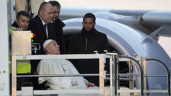 Pope Francis boards an airplane at Rome's Fiumicino, airport as he leaves for his one-day visit to Ajaccio in the French island of Corsica. AP