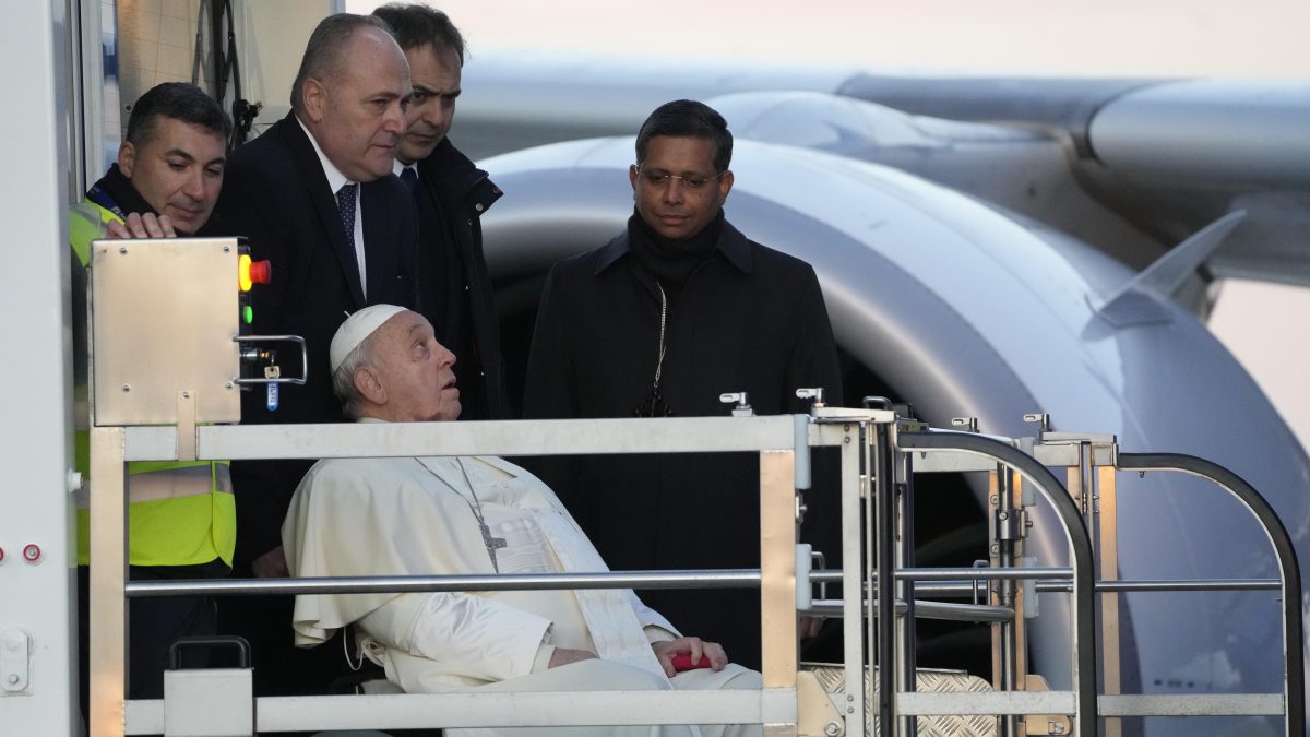 Pope Francis boards an airplane at Rome's Fiumicino, airport as he leaves for his one-day visit to Ajaccio in the French island of Corsica. AP Pope Francis boards an airplane at Rome's Fiumicino, airport as he leaves for his one-day visit to Ajaccio in the French island of Corsica. AP