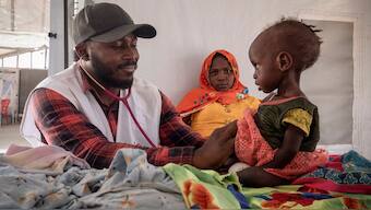 A doctor treats a Sudanese child suffering from malnutrition are treated at an MSF clinic in Metche Camp, Chad, near the Sudanese border, on April 6, 2024. File Image- AP