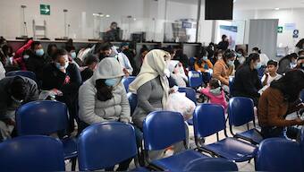 Guatemalan migrants deported from the United States are assisted at the Returnee Reception Center upon arrival at the Guatemalan Air Force Base in Guatemala City on December 27, 2024, during the last deportee flight of the year. Image- AFP