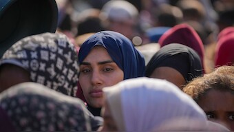 Women line up to receive donated food at a distribution center for displaced Palestinians in Deir al-Balah, Gaza Strip, on Dec. 17, 2024. Image- AP
