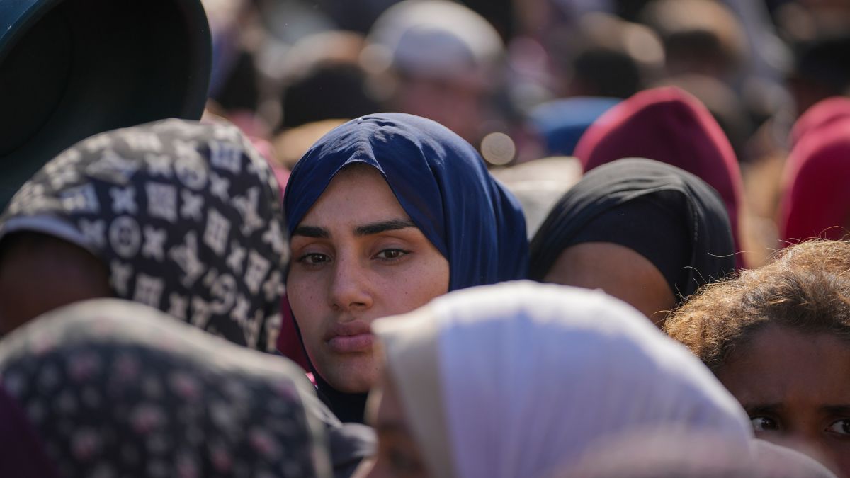 Women line up to receive donated food at a distribution center for displaced Palestinians in Deir al-Balah, Gaza Strip, on Dec. 17, 2024. Image- AP Women line up to receive donated food at a distribution center for displaced Palestinians in Deir al-Balah, Gaza Strip, on Dec. 17, 2024. Image- AP