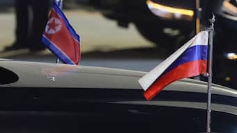 A view shows flags of Russia and North Korea attached to a car during a ceremony welcoming Russia's President Vladimir Putin at an airport in Pyongyang, North Korea. File image/ Reuters