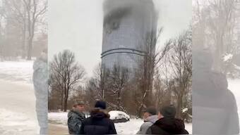 In this photo released Saturday, Dec. 21, 2024, by the official Telegram channel of the Kazan City Hall, local officials look at a damage site at the residential complex called "Lazurnye Nebesa," or Azure Skies, in Kazan, Russia, following Ukrainian drone attacks. AP