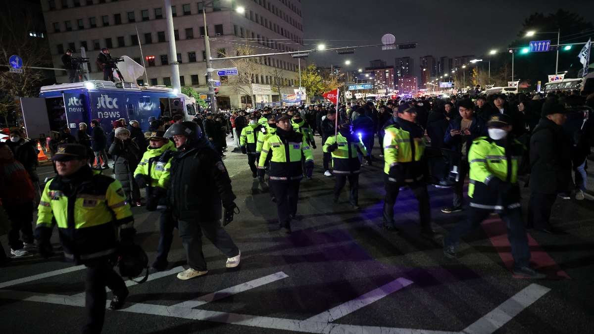 Police officers walk among the crowd, after South Korean President Yoon Suk Yeol declared martial law, in Seoul, South Korea, on Wednesday. Reuters Police officers walk among the crowd, after South Korean President Yoon Suk Yeol declared martial law, in Seoul, South Korea, on Wednesday. Reuters