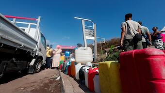 People wait to get fuel, in the aftermath of Cyclone Chido, in Dzaoudzi, Mayotte, on Friday. Reuters File