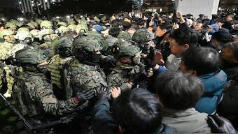 Soldiers try to enter the National Assembly building in Seoul on Wednesdy, after South Korea President Yoon Suk Yeol declared martial law. AFP 
