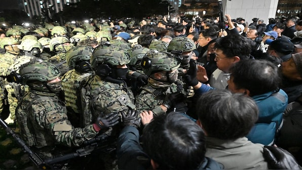 South Korean lawmakers block President Yoon's martial law decree as thousands protest