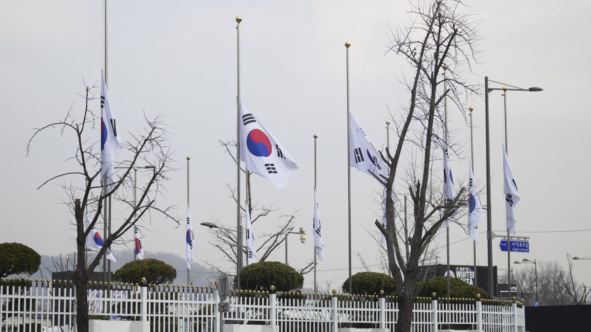 South Korean national flags fly at half-staff at a government complex in Seoul, South Korea, a day after a jetliner skidded off a runway, slammed into a concrete fence and burst into flames at an airport the town of Muan. AP South Korean national flags fly at half-staff at a government complex in Seoul, South Korea, a day after a jetliner skidded off a runway, slammed into a concrete fence and burst into flames at an airport the town of Muan. AP
