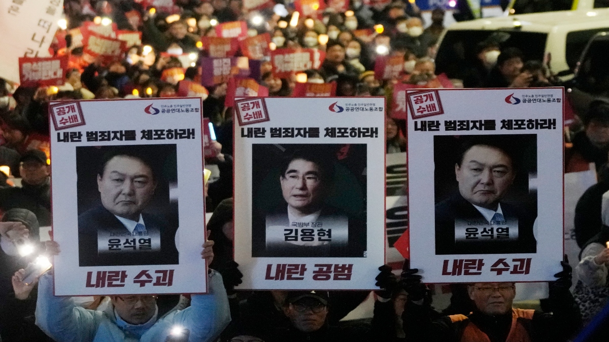Protesters with images of South Korean President Yoon Suk Yeol and former South Korea Defence Minister Kim Yong Hyun, center, march to the presidential office after a candlelight vigil against President Yoon in Seoul, South Korea, on Dec. 5, 2024. AP File Protesters with images of South Korean President Yoon Suk Yeol and former South Korea Defence Minister Kim Yong Hyun, center, march to the presidential office after a candlelight vigil against President Yoon in Seoul, South Korea, on Dec. 5, 2024. AP File