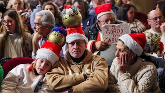 People wear Christmas-themed hats on the day of Spain's Christmas lottery "El Gordo" (The Fat One), in Madrid, Spain. Reuters