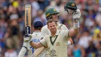 Senior Australia batter Steven Smith raises his bat in celebration after completing his 34th Test hundred on Day 2 of the fourth Test against India. AP