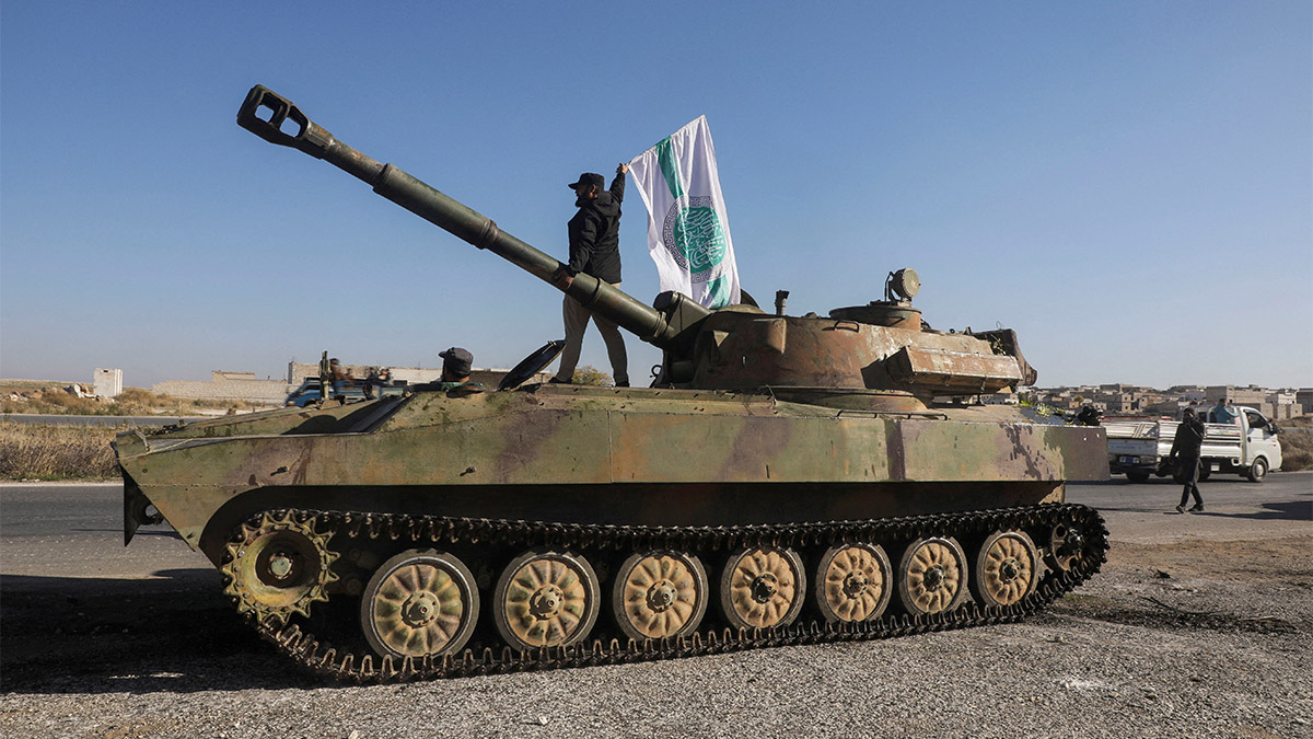A rebel fighter stands atop of a military vehicle as he carries a Hayat Tahrir al-Sham flag in Saraqeb town in northwestern Idlib province, Syria December 1, 2024. Reuters A rebel fighter stands atop of a military vehicle as he carries a Hayat Tahrir al-Sham flag in Saraqeb town in northwestern Idlib province, Syria December 1, 2024. Reuters