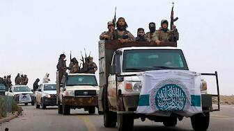 (File) Members of Hayat Tahrir al-Sham, or HTS, AP