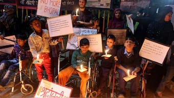 Children born with congenital disease, second generation victims of the1984 Bhopal gas tragedy, participate in a candle light vigil to pay homage to the people killed in the tragedy in Bhopal on December 2, 2013. File Photo/AFP