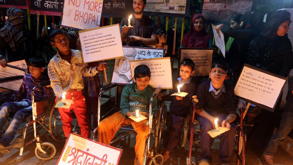 Children born with congenital disease, second generation victims of the1984 Bhopal gas tragedy, participate in a candle light vigil to pay homage to the people killed in the tragedy in Bhopal on December 2, 2013. File Photo/AFP Children born with congenital disease, second generation victims of the1984 Bhopal gas tragedy, participate in a candle light vigil to pay homage to the people killed in the tragedy in Bhopal on December 2, 2013. File Photo/AFP