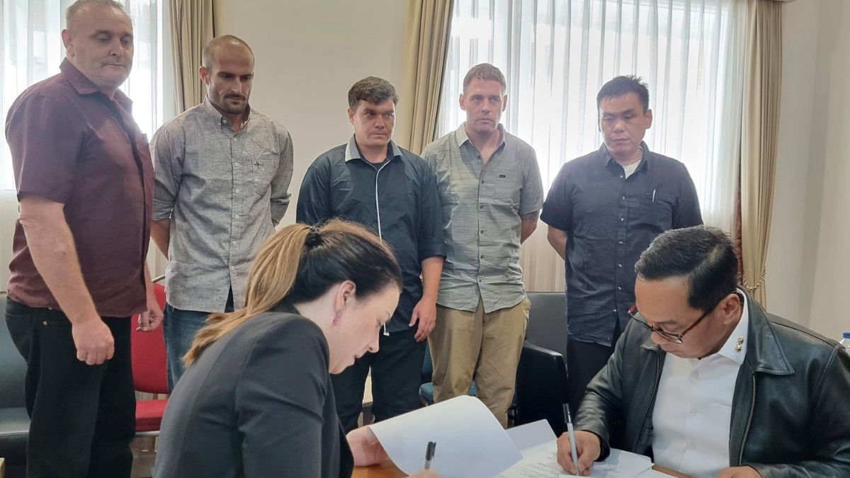 In this photo released by the Indonesian Coordinating Ministry for Legal, Human Rights, Immigration and Correctional Affairs, Indonesian and Australian officials sign handover documents as five Australians who have spent almost 20 years in Indonesian prisons for heroin trafficking look on, prior to their return to Australia, in Bali, Indonesia, December 15, 2024. AP In this photo released by the Indonesian Coordinating Ministry for Legal, Human Rights, Immigration and Correctional Affairs, Indonesian and Australian officials sign handover documents as five Australians who have spent almost 20 years in Indonesian prisons for heroin trafficking look on, prior to their return to Australia, in Bali, Indonesia, December 15, 2024. AP