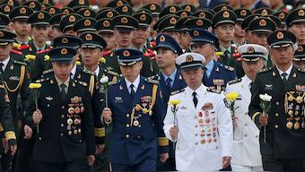 Members of the Chinese People's Liberation Army (PLA) and People's Armed Police (PAP) attend a ceremony to commemorate Martyrs' Day. Reuters/Representational image