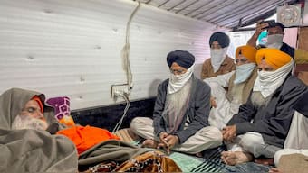 Shiromani Gurdwara Parbandhak Committee (SGPC) President Harjinder Singh Dhami meets farmer leader Jagjit Singh Dallewal, who is on an indefinite fast at Khanauri border at Khanauri border since November 26, in Sangrur district, Punjab, December 18, 2024. PTI