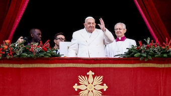 Pope Francis waves on the day he delivers his traditional Christmas Day Urbi et Orbi speech to the city and the world from the main balcony of St. Peter's Basilica at the Vatican, December 25, 2024. Reuters