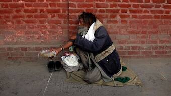 A man begs on a street in the old city of Lahore. Reuters/File Photo
