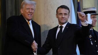 French President Emmanuel Macron welcomes President-elect Donald Trump as he arrives at the Elysee Palace, Saturday, Dec. 7, 2024 in Paris. AP