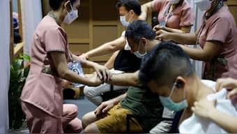 People receive massages from Thai massage therapists at the Labour Ministry booth, during the Asia-Pacific Economic Cooperation (APEC) summit in Bangkok on November 18, 2022. Representational Image/AFP