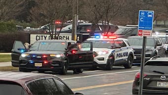 Emergency vehicles are parked outside the Abundant Life Christian School in Madison, Wis., where multiple injuries were reported following a shooting, Monday. AP 